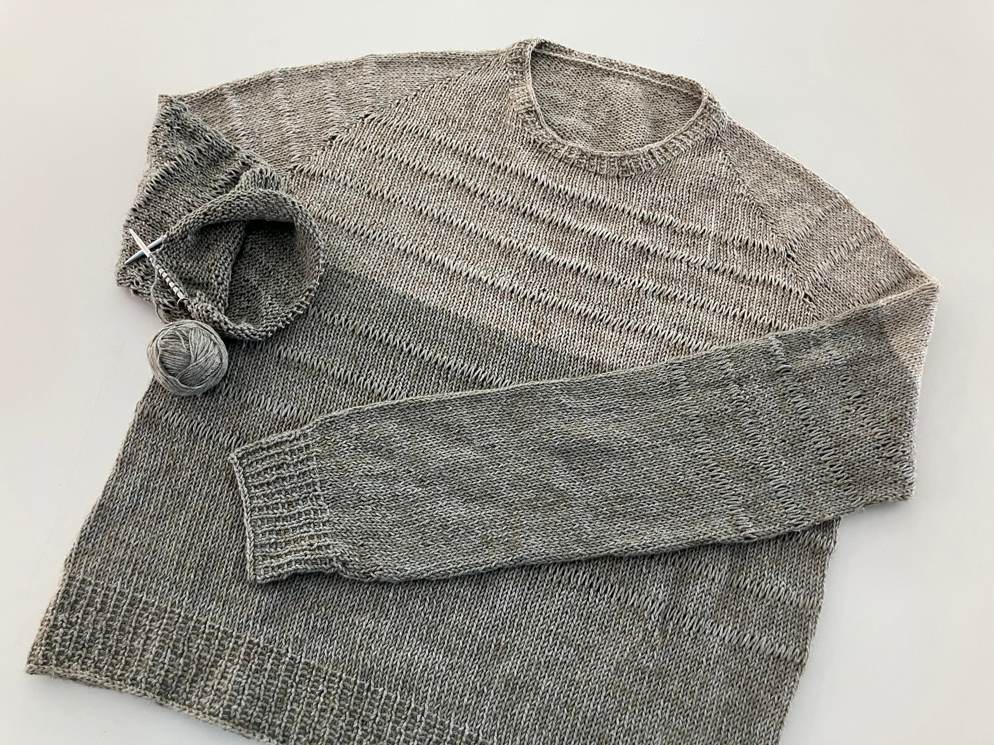 A light summer sweater. Knit with bands of elongated stitches. It  is also perfect for fall and spring.