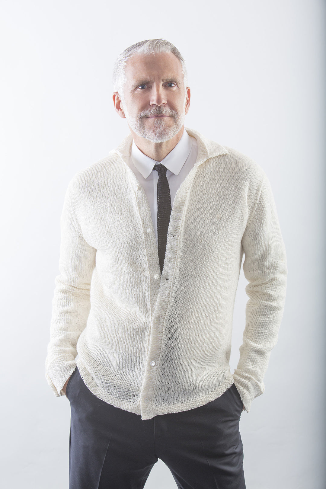 Robert Linen Dress Shirt in White on model - buttoned over dress shirt and tie – James Cox Knits